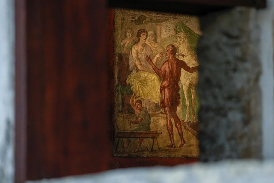 A detail of one of the frescoes in a "triclinium", or dining room, called " Hall of Ixium", part of the Ancient Roman Domus Vettiorum, House of Vettii, the 'peristylium', or courtyard, in the center of the Ancient Roman Domus Vettiorum, House of Vettii, in the Pompeii Archeological Park, near Naples, southern Italy, Wednesday, Dec. 14, 2022. One of Pompeii's most famous and richest domus, which contains exceptional works of art and tells the story of the social ascent of two former slaves, is opening its doors to visitors Wednesday, Jan. 11, 2023 after 20 years of restoration. (AP Photo/Andrew Medichini)
