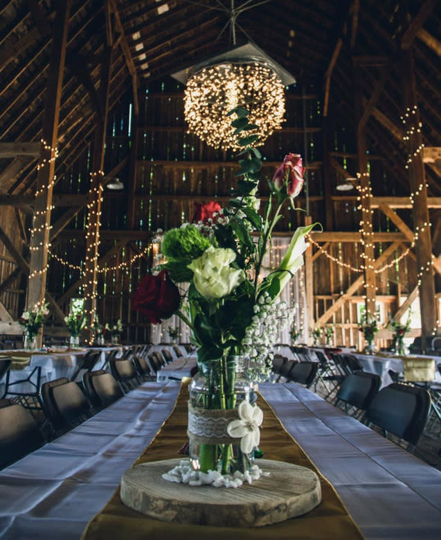 Image of centrepiece at wedding, chairs very close no social distancing.