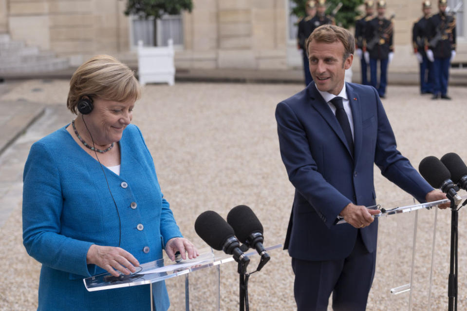 President of France, Emmanuel Macron and former Chancellor of Germany, Angela Merkel, speak to press at the Elysee Palace in Paris, France on Sept. 16 2021.<span class="copyright">Julien Mattia—Anadolu Agency/Getty Images</span>