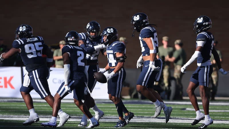 Utah State Aggies safety Jordan Vincent (24) intercepts the ball against Utah in Logan on Saturday, Sept. 14, 2024.