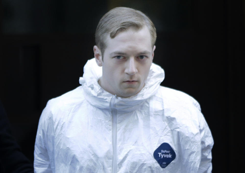 James Harris Jackson is escorted out of a police precinct in New York, Wednesday, March 22, 2017. Police said Jackson, accused of fatally stabbing a black man in New York City, told investigators he traveled from Baltimore specifically to attack black people. (AP Photo/Seth Wenig)