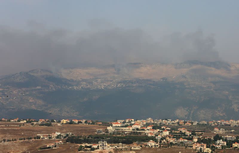 Smoke rises from the disputed Shebaa Farms area as seen from Marjayoun village