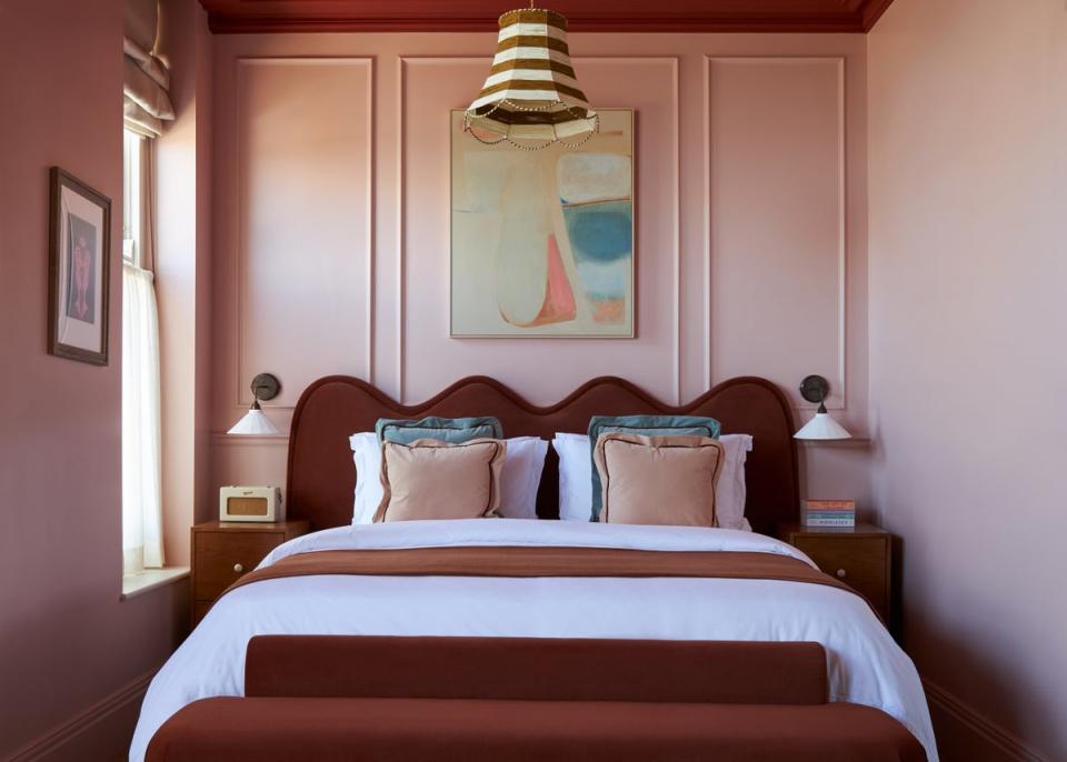 Everything from skirting boards to ceilings is drenched in warm pink, terracotta and burgundy in the boutique hotel  (Boz Gagovski/Margate House)