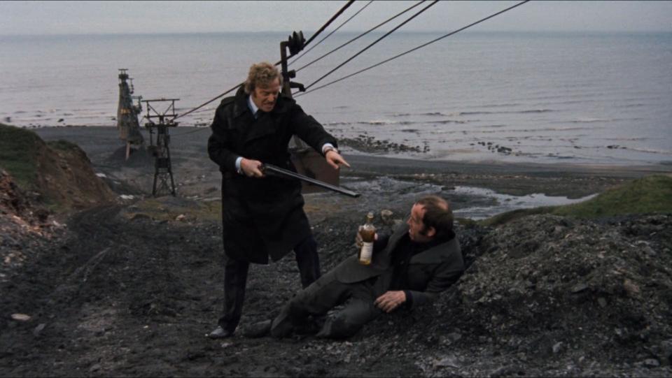 London.UK. Michael Caine and Ian Hendry in a scene from the ©MGM film Get Carter (1971) Director: Mike Hodges Screenplay: Mike Hodges Source: Ted Lewis's novel Jack's Return Ref: LMK110-SLIB270220-001 Provided by LMKMEDIA. Editorial only. Landmark Media does not own the copyright to these Film or TV stills but only provides a service to recognised Media outlets. pictures@lmkmedia.com