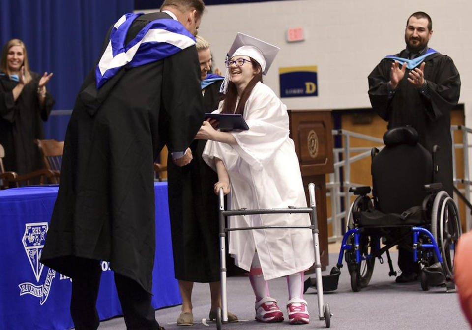 Lexi Wright, 19, has stunned her family and peers after walking at her graduation for the first time. Source: Kevin Graff/ Record Courier via AP