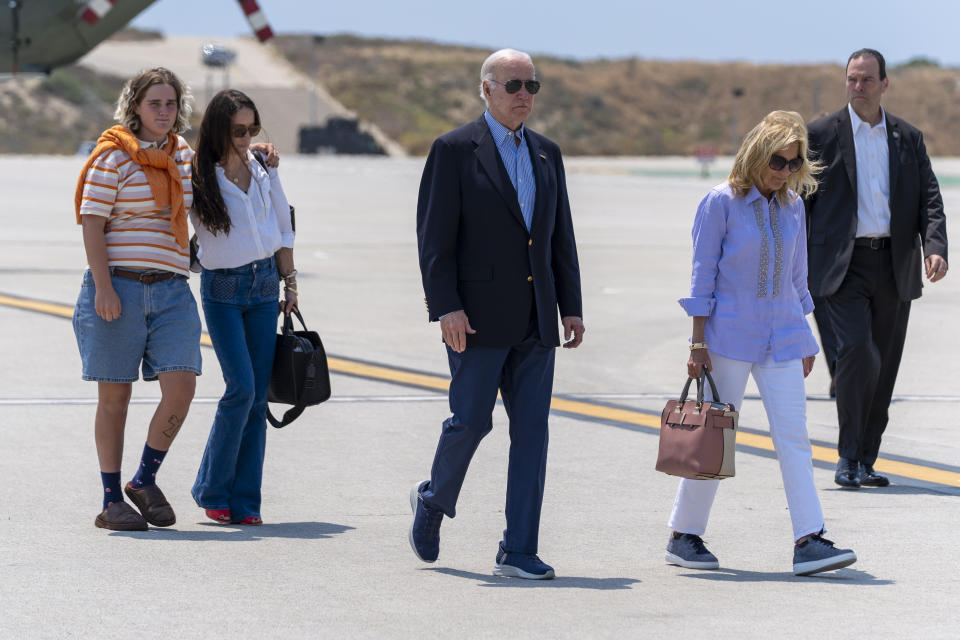 From left, Maisy Biden, Naomi Biden, President Joe Biden and first lady Jill Biden walk to depart on Air Force One from Los Angeles International Airport, Sunday, June 16, 2024, in Los Angeles. Biden is returning to Washington after a campaign event. (AP Photo/Alex Brandon)