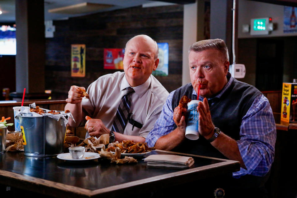 Dirk Blocker and Joel McKInnon Miller eat buffalo wings at a tacky chain restaurant