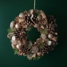 <p>Another wreath being stocked by Waitrose this year is this champagne pinecone wreath. 'Champagne is a hugely popular colour thanks to its soft, neutral tones, with added sparkle just for Christmas,' explain Waitrose.</p>