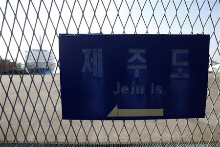 South Korean ferry Ohamana (L), which is owned by Chonghaejin Marine Co, is docked at Incheon Port Passenger Terminal in Incheon April 22, 2014. REUTERS/Kim Hong-Ji