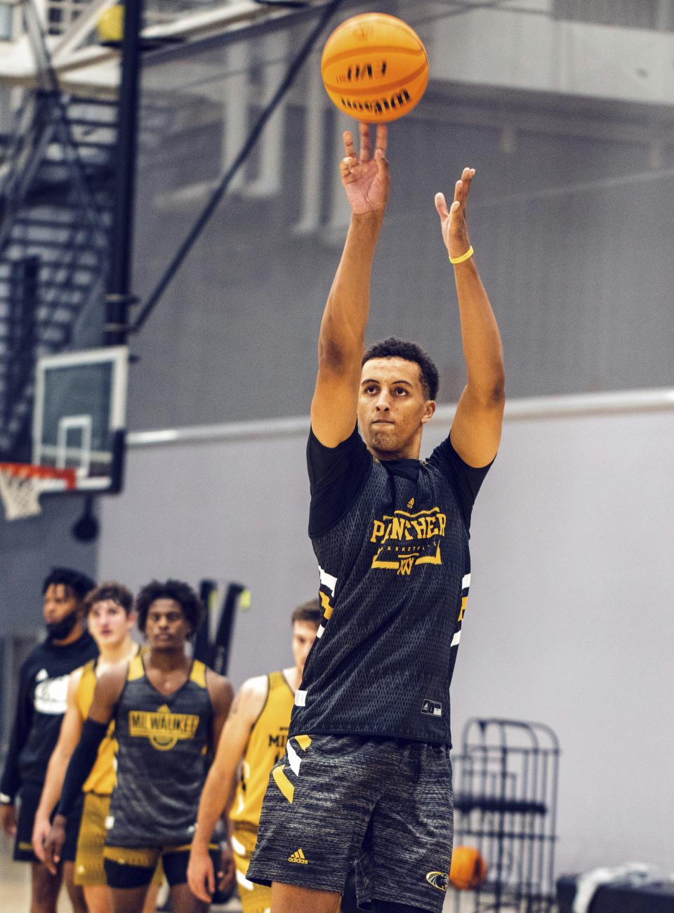 In this image provided by Milwaukee Athletics, Milwaukee freshman Patrick Baldwin works out during the Panthers’ first day of preseason NCAA college basketball practice, Tuesday, Sept. 28, 2021, in Milwaukee. Baldwin, rated as one of the nation’s top 10 prospects in his class, passed up offers from blueblood programs to play college basketball on a Milwaukee team that is coached by his father. (Ashley Steltenpohl/Milwaukee Athletics via AP)