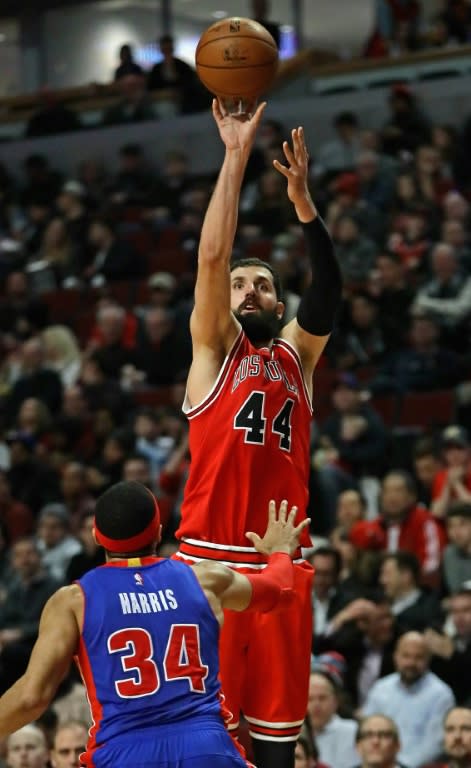 Nikola Mirotic scored 22 points as the Chicago Bulls beat the Philadelphia 76ers 102-90 to boost their playoff prospects