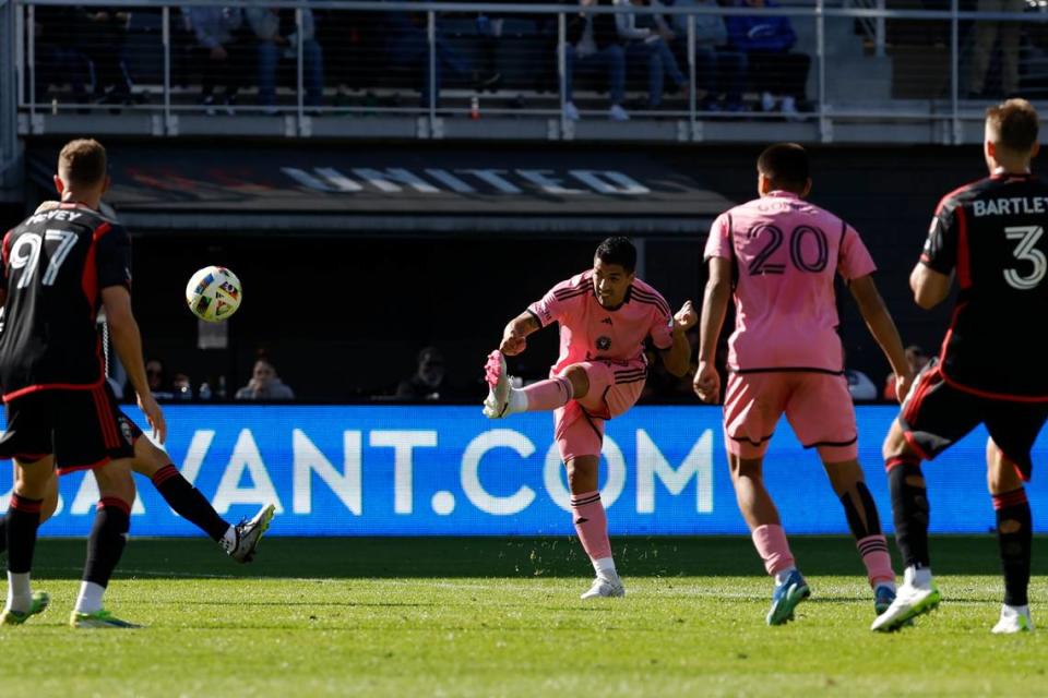 Mar 16, 2024; Washington, District of Columbia, USA; Inter Miami CF forward Luis Suarez (9) shoots the ball as D.C. United defend during the second half at Audi Field. Mandatory Credit: Geoff Burke-USA TODAY Sports