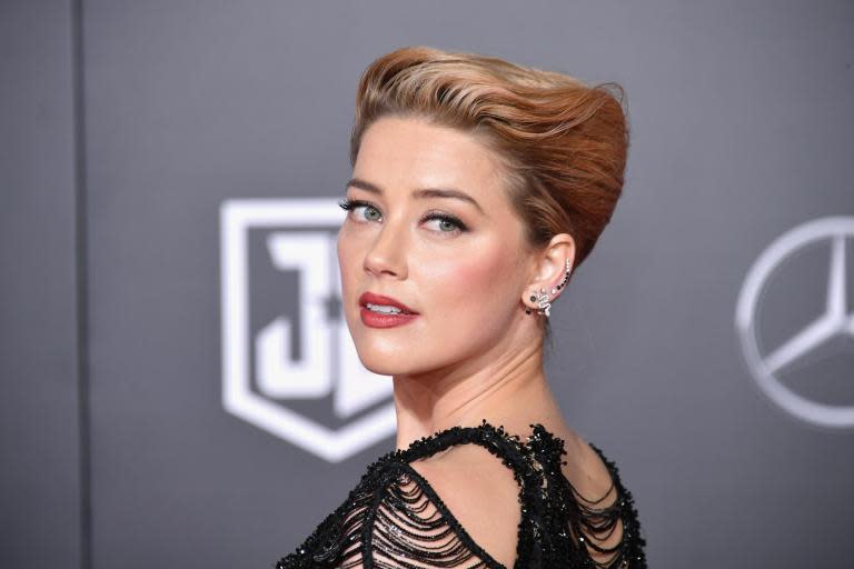 Amber Heard reposts joint Johnny Depp statement following JK Rowling's defence of Fantastic Beasts 2 star