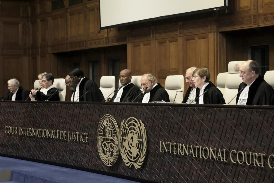 Judges preside over the opening of the hearings at the International Court of Justice in The Hague, Netherlands, Thursday, Jan. 11, 2024. The United Nations' top court opens hearings Thursday into South Africa's allegation that Israel's war with Hamas amounts to genocide against Palestinians, a claim that Israel strongly denies. (AP Photo/Patrick Post)