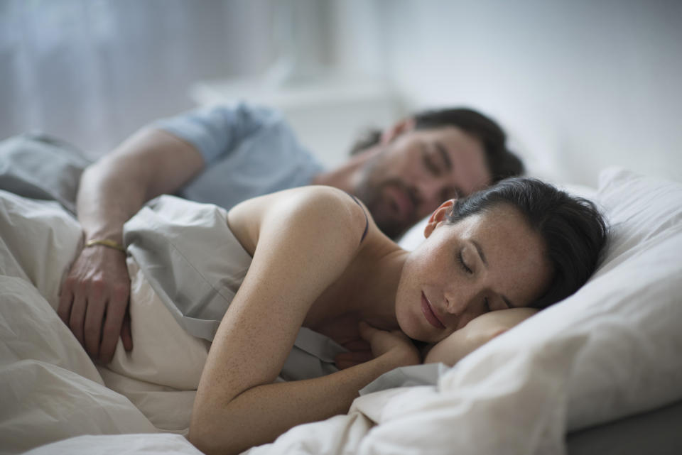 Couple in bed together. (Getty Images)