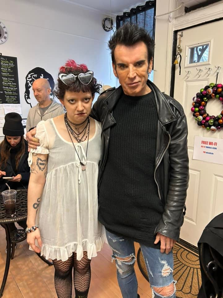 Olivia Pereira, who runs Miss Lizzie's Coffee along with her father Joe Pereira, poses with famous musician Simon Gallup, of The Cure, who stopped into the Fall River shop Wednesday, April 3, 2024.