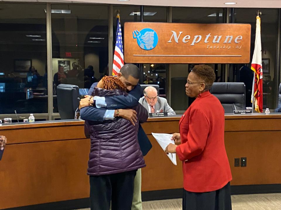 Derel M. Stroud embraces his mother after being sworn in as the new Neptune Township Committee member by Mayor Tassie York at the Feb. 12, 2024, meeting.