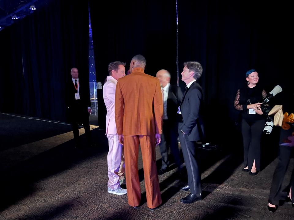 Actors Robert Downey Jr., Colman Domingo, Cillian Murphy and Paul Giamatti share a moment together backstage at the Palm Springs International Film Festival on Jan. 4, 2024.