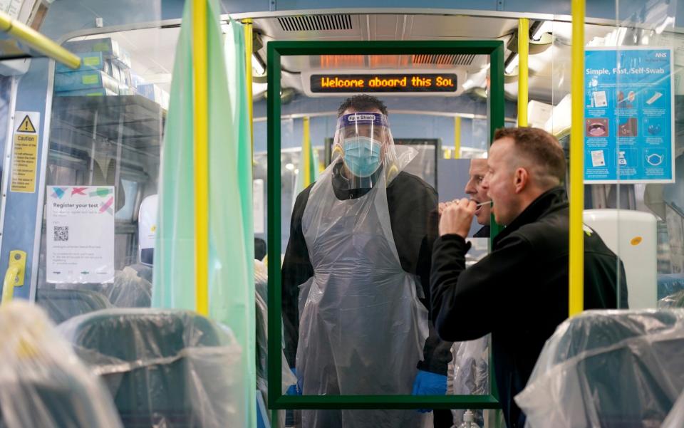 Railway staff carry out lateral flow covid tests on colleagues in a temporary testing facility on a converted train -  Chris Eades/Getty Images Europe