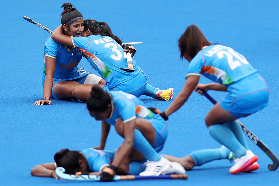 <p>Navneet Kaur, Neha Neha and Lalremsiami of Team India celebrate their 1-0 win with teammates while Karri Somerville reacts after the Women's Quarterfinal match between Australia and India on day ten of the Tokyo 2020 Olympic Games at Oi Hockey Stadium on August 02, 2021 in Tokyo, Japan. (Photo by Buda Mendes/Getty Images)</p> 