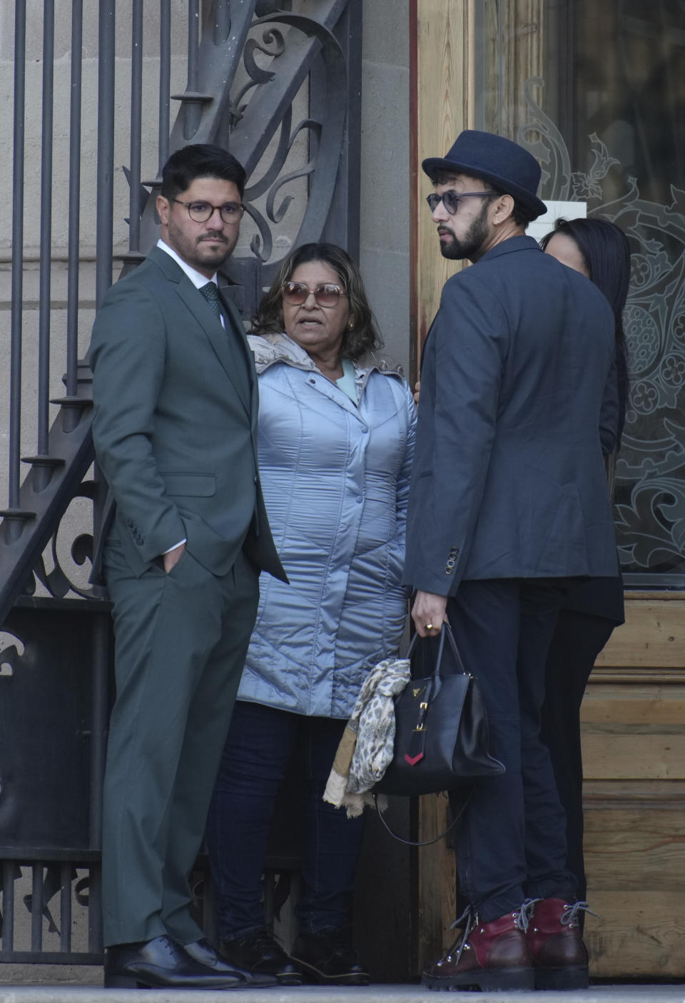 Brazilian soccer star Dani Alves' mother Lucia, centre stands outside the court before the start of a trial in Barcelona, Spain, Monday, Feb. 5, 2024. Dani Alves is on trial for allegedly sexually assaulting a young woman at a Barcelona night club in December 2022 and has spent the past year in pre-trial jail after his bail requests were rejected. He denies any wrongdoing. (AP Photo/Emilio Morenatti)