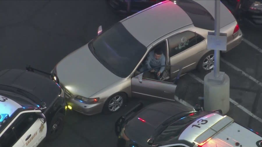 The male driver eventually surrendered to deputies. (KTLA)