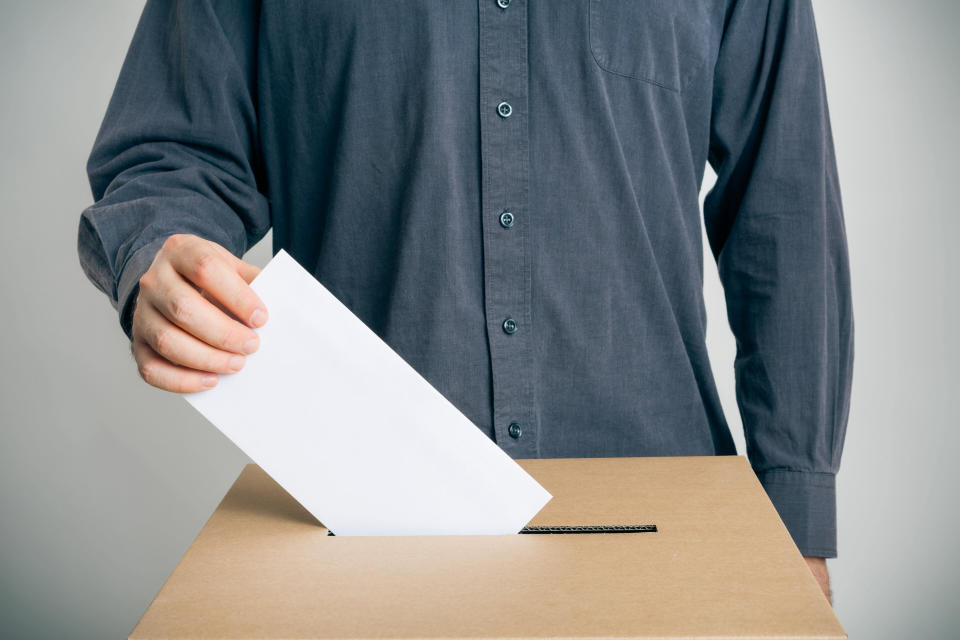 Man casts a paper vote. Source: Getty