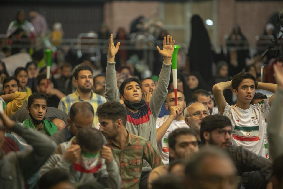 Iranian football fans watch the Qatar 2022 World Cup Group B football match against the United States in a government center on November 29, 2022 in Tehran, Iran. / Credit: Getty Images