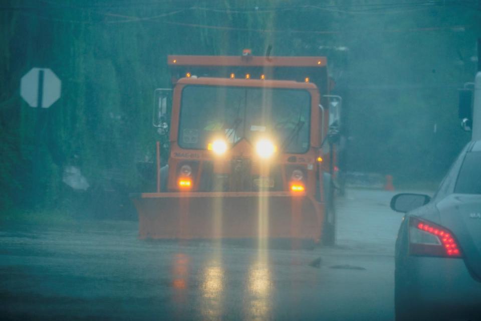 Truck drives through flooded streets in the Hole neighbourhood in New York (REUTERS)