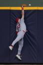 St. Louis Cardinals' Michael Siani can't catch a three-run home run hit by Milwaukee Brewers' Rhys Hoskins during the seventh inning of a baseball game Saturday, May 11, 2024, in Milwaukee. (AP Photo/Morry Gash)