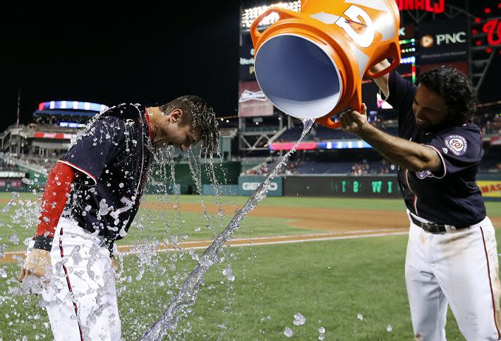 Trea Turner (left) receives a Gatorade bath after hitting a walk-off homer in Friday's win against the Phillies. (AP)