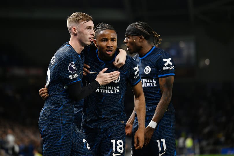 Chelsea players celebrate goal against Brighton