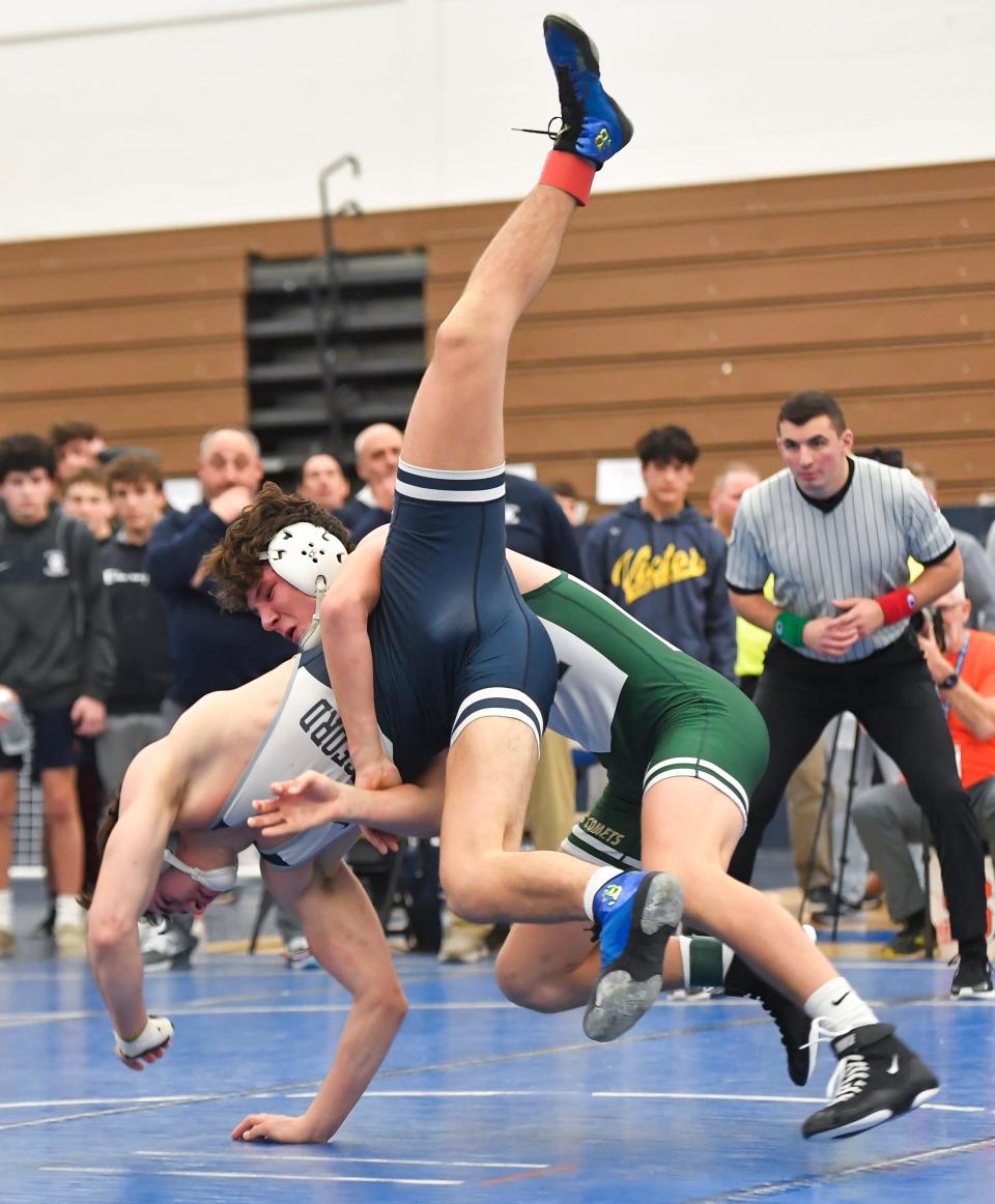 Rush-Henrietta’s Jackson Koppers, right, wrestles Pittsford’s Rudy Antonucci in the final of the 160-pound weight class during the Monroe County Wrestling Championships, Saturday, Dec. 16, 2023.