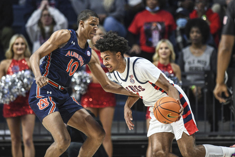 Mississippi forward Jaemyn Brakefield (4) is defended by Auburn forward Jabari Smith (10) during the first half of an NCAA college basketball game in Oxford, Miss., Saturday, Jan. 15, 2022. (AP Photo/Bruce Newman)