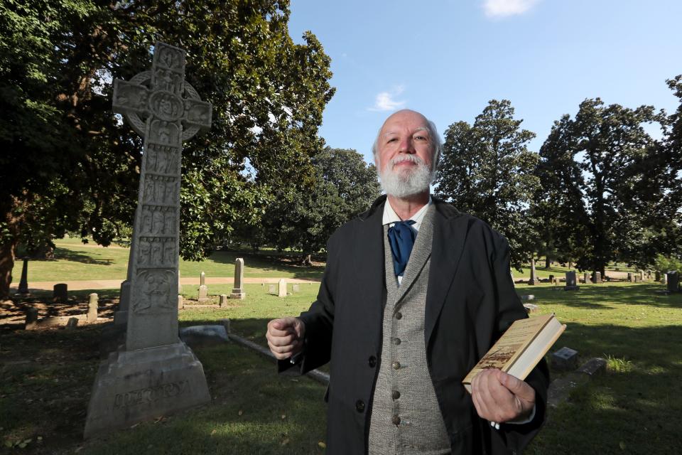 Vincent Astor, dressed as and representing James Davis, a 19th-century journalist who authored one of the first "history of Memphis" books, poses for a portrait at Elmwood Cemetery on Sept 30, 2018.