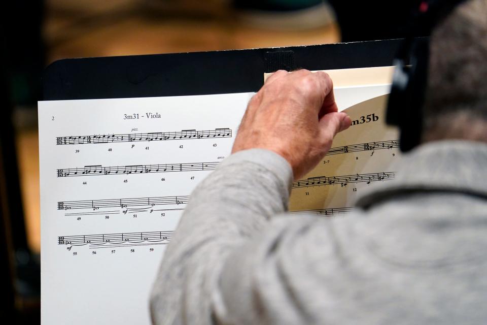 Conductor Daniel Slatkin, works on a score with the Detroit Symphony Orchestra for the documentary 'Gradually, Then Suddenly: The Bankruptcy of Detroit' at the DSO in Detroit on Dec. 6, 2021.