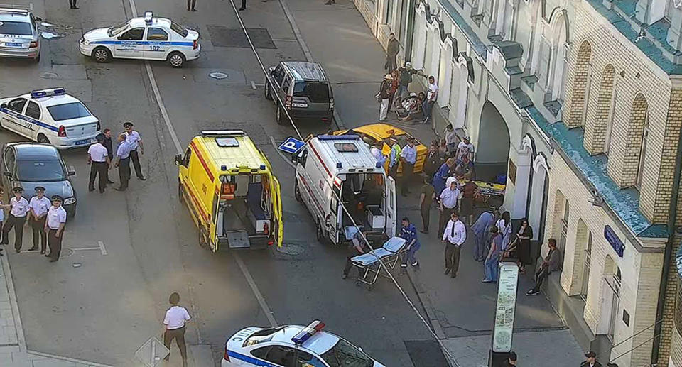 Ambulance and police attend the scene near Red Square in Moscow. (Via AP)