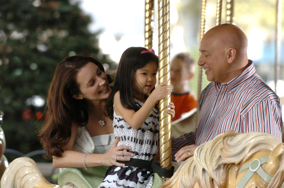 UNITED STATES - OCTOBER 16:  Kristen Davis ( Charlotte) and Evan Handler (Harry Goldenblatt) on the carousel with their daughter filming Sex And The City in Bryant Park  (Photo by Richard Corkery/NY Daily News Archive via Getty Images)