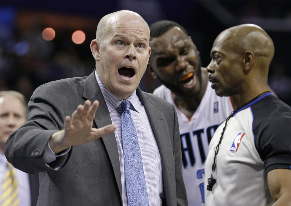 Charlotte Bobcats coach Steve Clifford argues a call with a referee during the second half of an NBA basketball game against the Chicago Bulls in Charlotte, N.C., Wednesday, April 16, 2014. The Bobcats won 91-86 in overtime. (AP Photo/Chuck Burton)