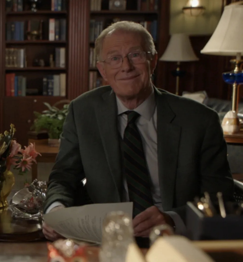 Dr Linkletter in a suit and tie sitting in an office