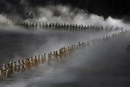 Actors perform during the opening ceremony of the 2014 Sochi Winter Olympics, February 7, 2014. REUTERS/Mark Blinch