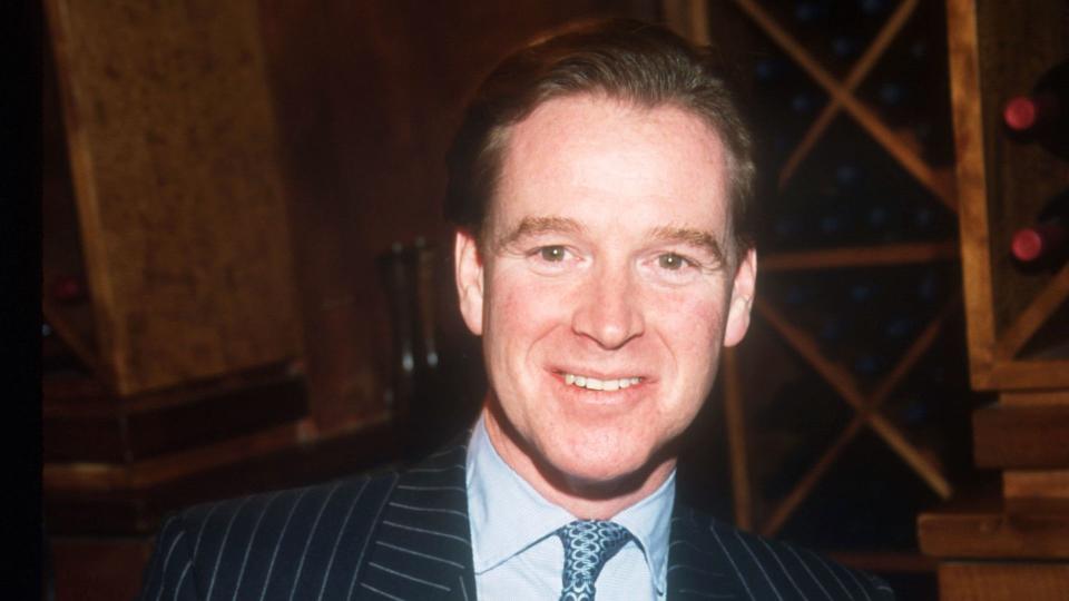 James Hewitt holding his book 'Love and War'