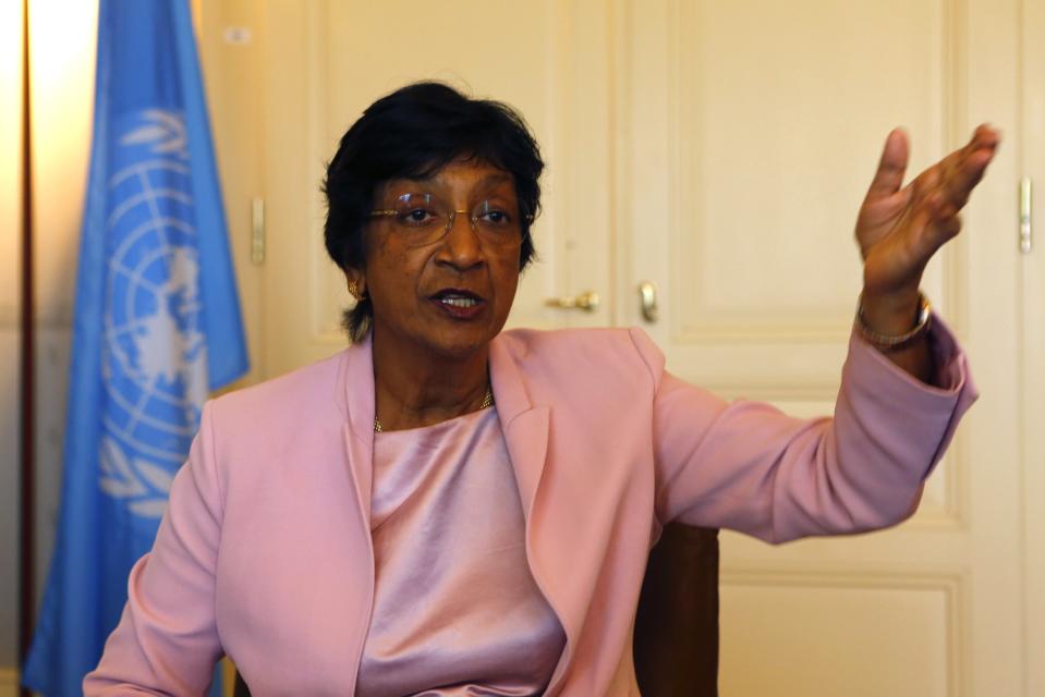 Outgoing U.N. Human Rights Commissioner Navi Pillay talks during an interview to Reuters in her office in Geneva August 19, 2014. Clashes between police and protesters in the U.S. town of Ferguson are reminiscent of the racial violence spawned by apartheid in her native South Africa, Pillay said on Tuesday. REUTERS/Ruben Sprich (SWITZERLAND - Tags: HEADSHOT POLITICS)