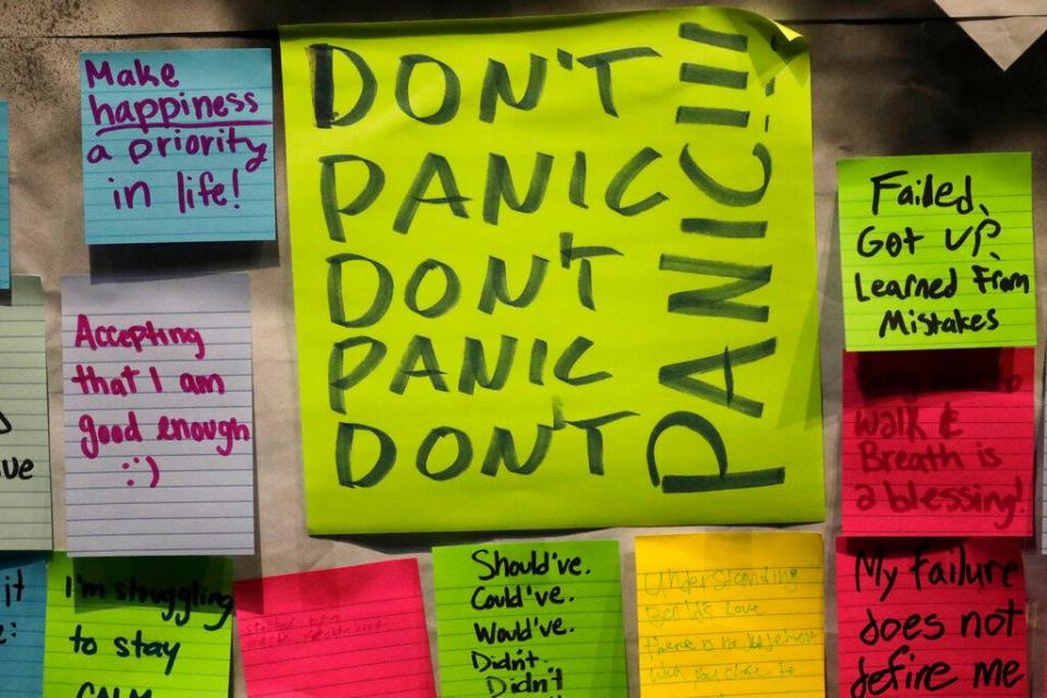 A photo shows notes attached to a "Resilience Project" board at Utah Valley University, part of an ongoing efforts to help college students dealing with anxiety, depression and other mental health problems.