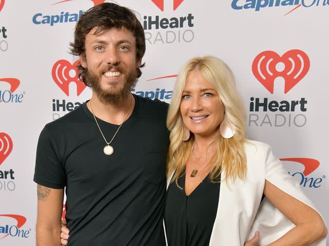 <p>Danny Matson/Getty</p> Chris Janson and Kelly Lynn arrive at the 2019 iHeartCountry Festival Presented by Capital One on May 4, 2019 in Austin, Texas.