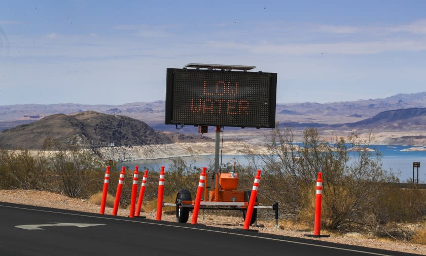 Lake Mead, NV - June 28: A sign warns visitors of the drought's effect at Hemenway Harbor, Lake Mead, Nevada Monday, June 28, 2021. Lake Mead is at its lowest level in history since it was filled 85 years ago, Monday, June 28, 2021. The ongoing drought has made a severe impact on Lake Mead and a milestone in the Colorado River's crisis. High temperatures, increased contractual demands for water and diminishing supply are shrinking the flow into Lake Mead. Lake Mead is the largest reservoir in the U.S., stretching 112 miles long, a shoreline of 759 miles, a total capacity of 28,255,000 acre-feet, and a maximum depth of 532 feet. (Allen J. Schaben / Los Angeles Times)