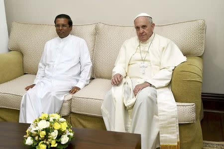 Pope Francis (R) sits next to Sri Lanka's newly elected president Mithripala Sirisena at the Presidential Secretary office in Colombo January 13, 2015. REUTERS/Giuseppe Cacace/Pool