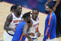 New York Knicks guard Alec Burks (18) celebrates his 3-point basket with teammates as he walks to the bench for a timeout in the second half of an NBA basketball game against the New Orleans Pelicans in New Orleans, Wednesday, April 14, 2021. The Knicks won 116-106. (AP Photo/Gerald Herbert)