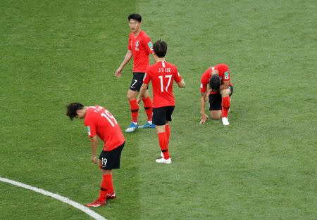 Soccer Football - World Cup - Group F - South Korea vs Mexico - Rostov Arena, Rostov-on-Don, Russia - June 23, 2018 South Korea's Son Heung-min and Lee Jae-sung look dejected after the match REUTERS/Darren Staples