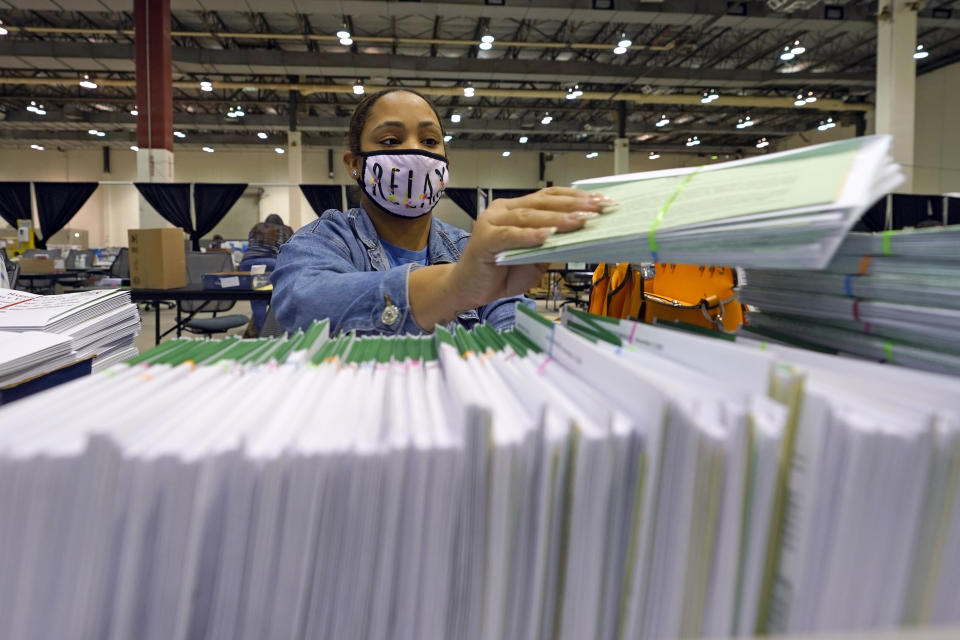 Harris County election worker Romanique Tillman prepares mail-in ballots to be sent out to voters Tuesday, Sept. 29, 2020, in Houston. (AP Photo/David J. Phillip) (Photo: ASSOCIATED PRESS)